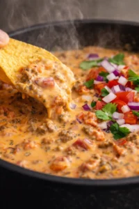 Velveeta Rotel Sausage Dip in a bowl with tortilla chips