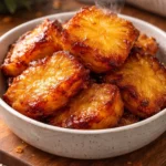 Crispy air fryer pineapple chunks served on a plate