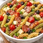 Classic pasta salad recipe with colorful vegetables and dressing