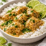 Crockpot Coconut Lime Chicken served with fresh lime and coconut garnish.