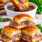 French Dip Sliders with tender beef, cheese, and au jus for dipping