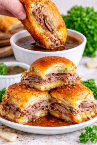 French Dip Sliders with tender beef, cheese, and au jus for dipping