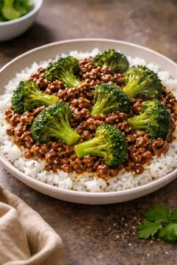 Stir-fried ground beef with broccoli and sauce in a skillet