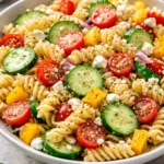 High Protein Greek Pasta Salad with fresh vegetables and herbs