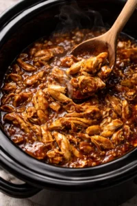 Delicious Crockpot Honey Garlic Chicken dish garnished with green onions.